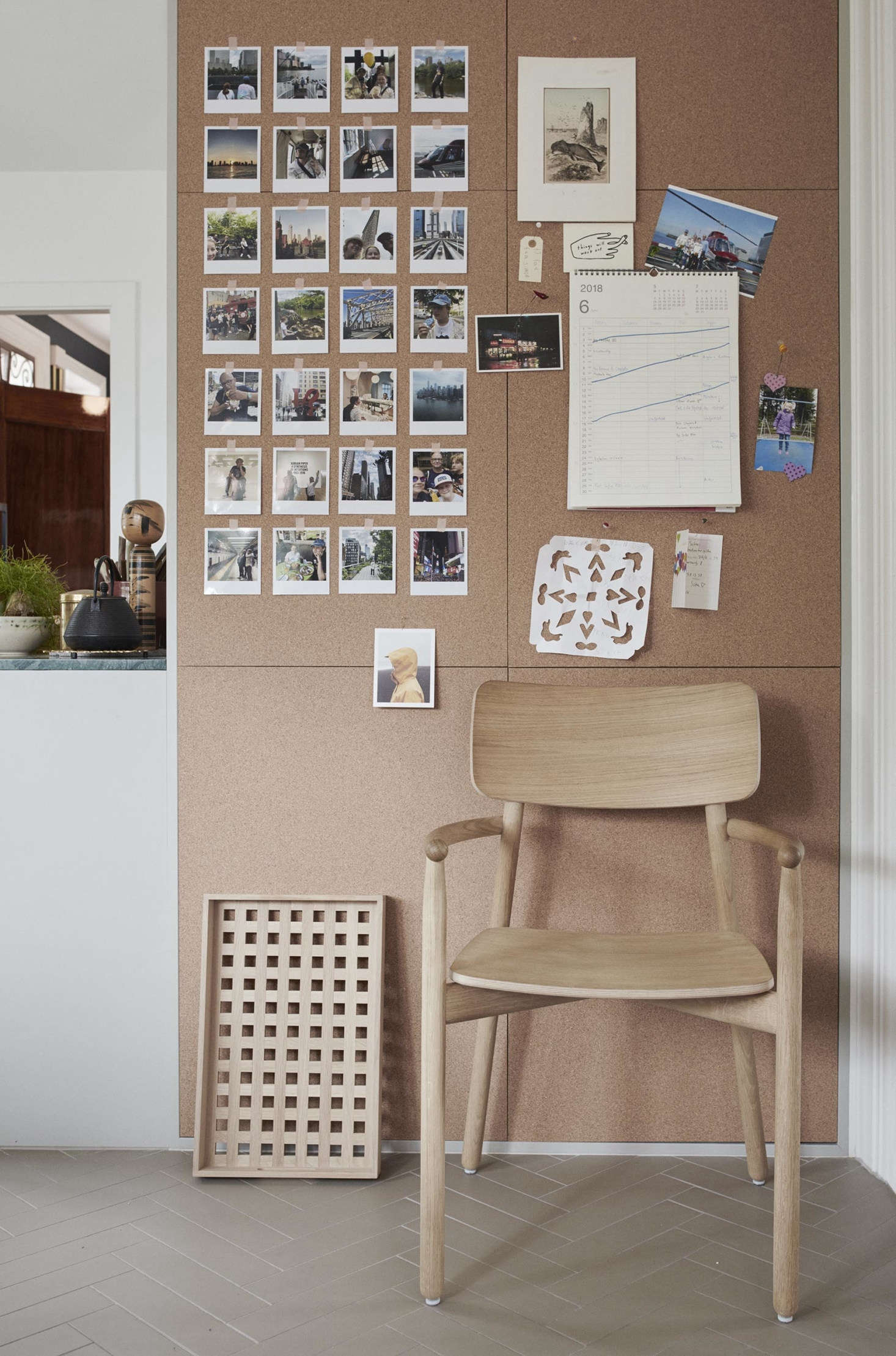 In the kitchen, a cork board wall displays the family calendar and a few favorite snapshots.