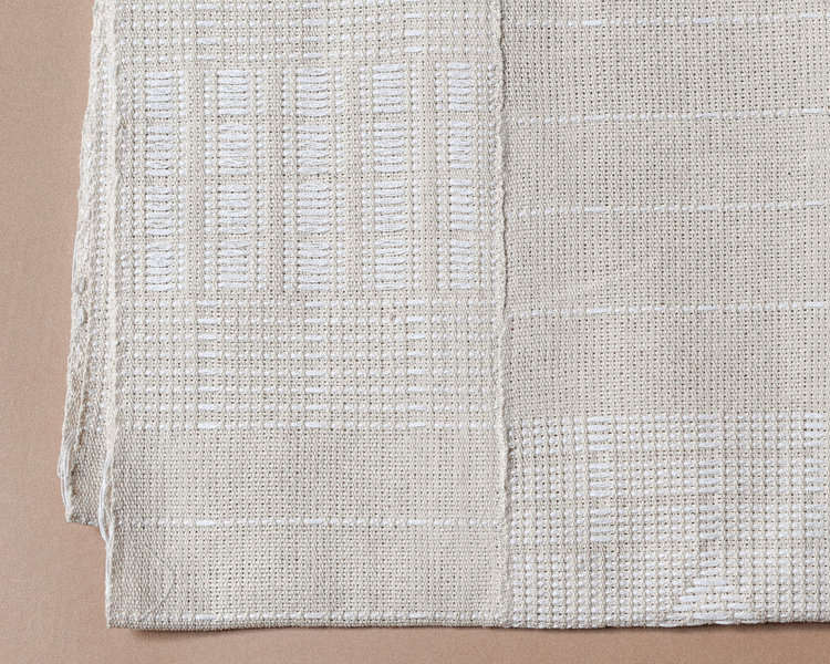 Even a tonal piece feels intricate and interesting thanks to expert weaving. The Artisanal Bedspread is $500.