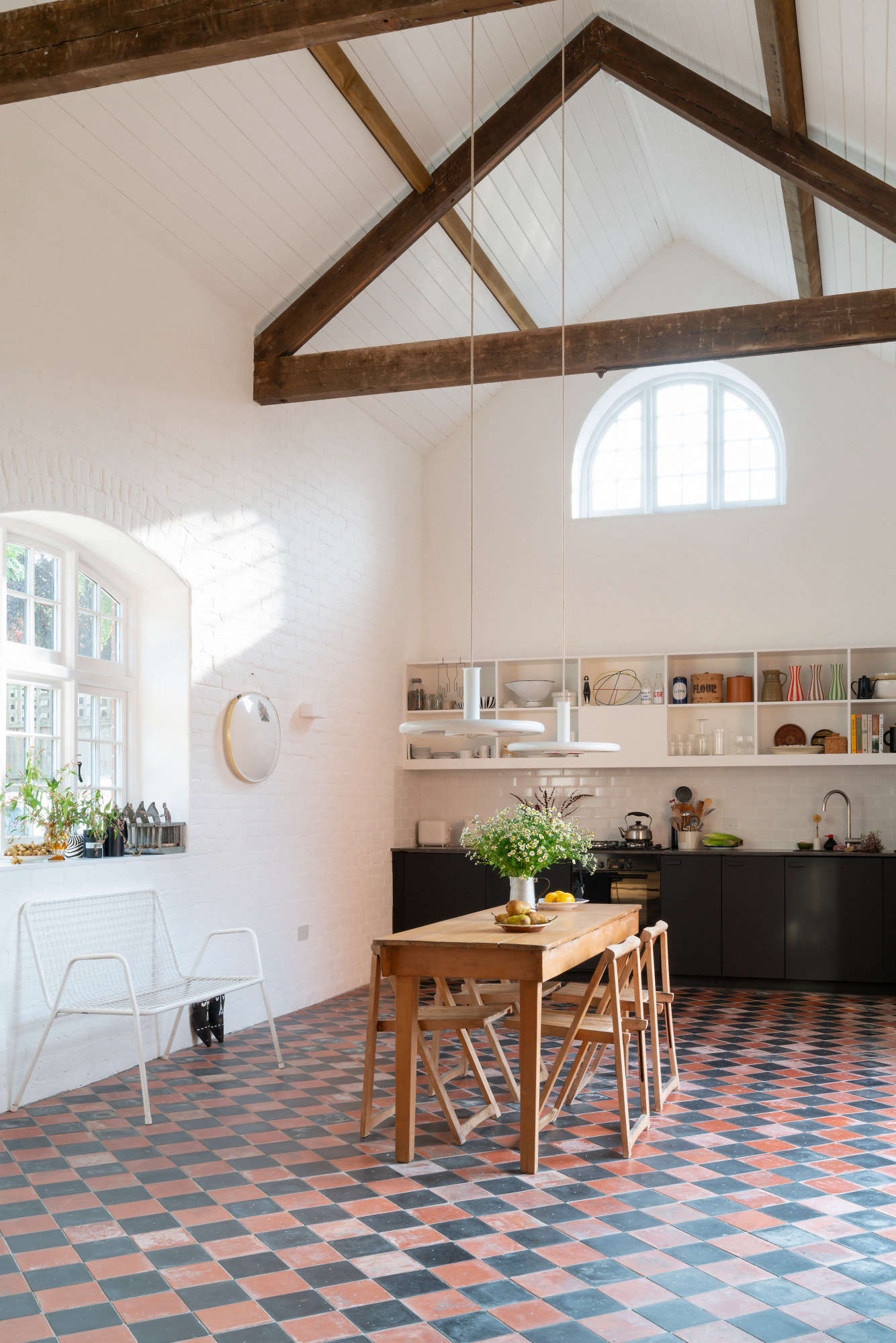 To make the building livable, the interior brick walls had to be covered in insulation. Wanting to preserve their original look, Sandy added an outer layer of brick (using reclaimed brick from the site and imperfect new brick), all “deliberately laid to look rough,” she says, “like the walls that sit hidden behind the insulation.”