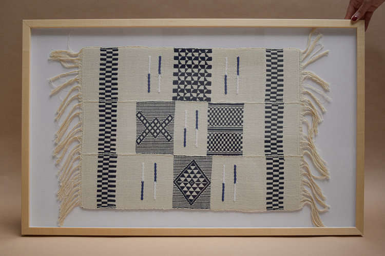 A Framed Dyula Textile is $250.
