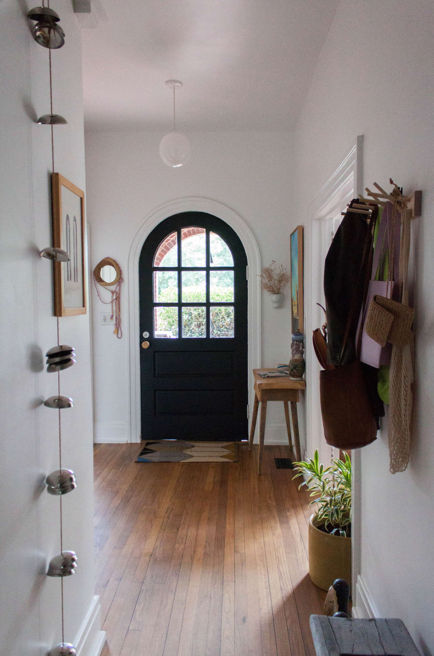 Gabi’s eclectic sensibility is apparent as soon as you enter the front door. The pendant light is from Schoolhouse; the doormat is by Alyson Fox for Hawkins NY; the console is from an antique store; and the Iris Hantverk hooks are from EA/ST Co.