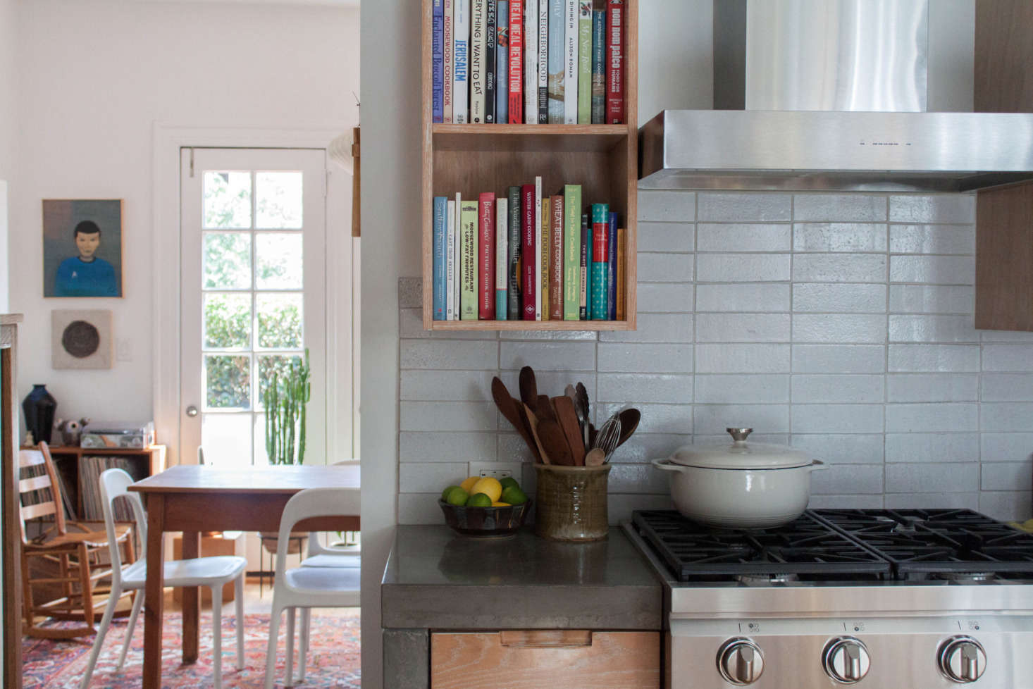 Fireclay tiles make up the backsplash. The utensil holder is by local potter Wade Franklin.