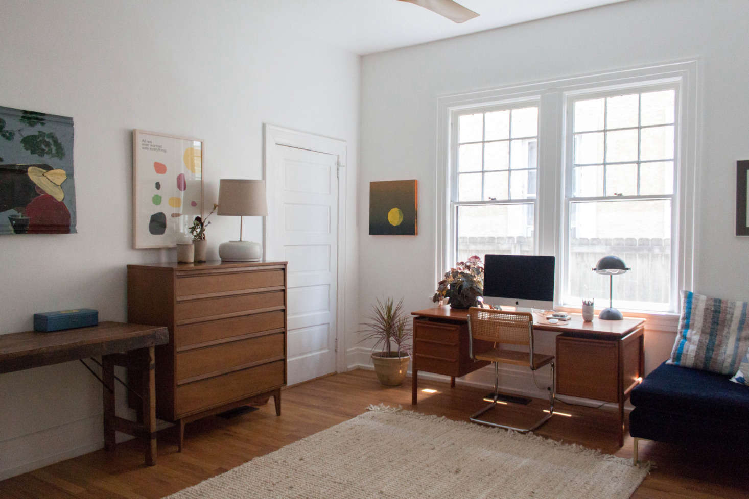 The office is appointed with mid-century vintage furniture.