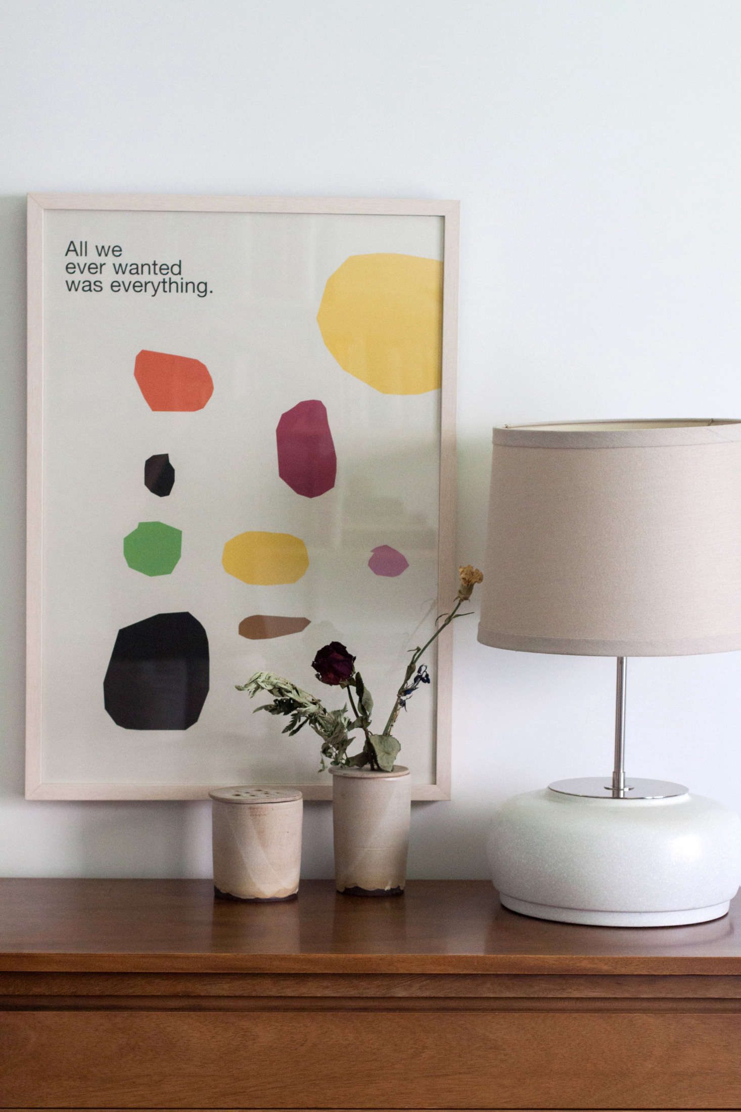 Gabi is a pro at styling her home. Case in point: A framed Mike Mills poster, a sculptural lamp (a gift from a friend), and Ikebana vases by Notary Ceramics make for a pretty tablescape.