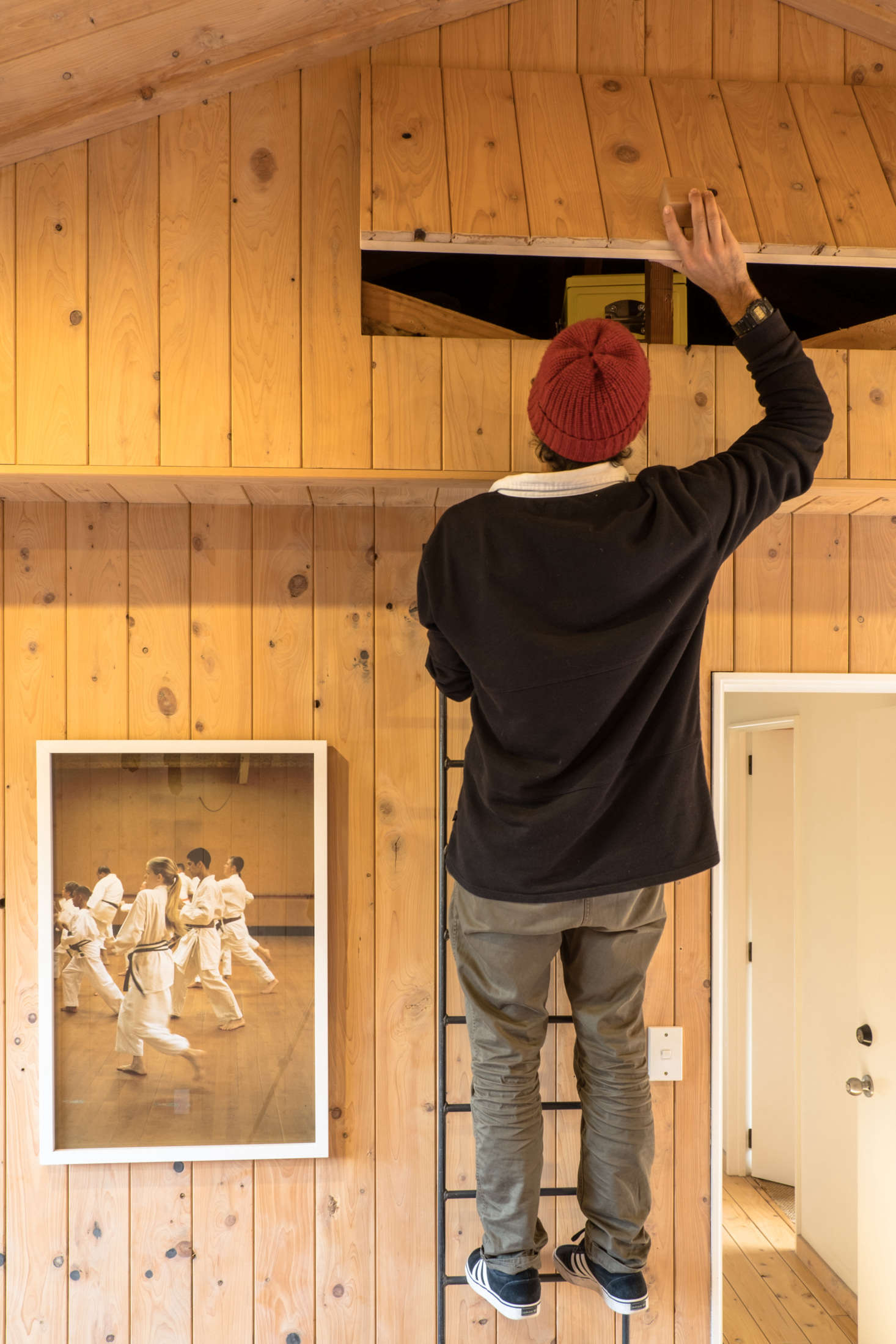 The storage area is accessed by a steel ladder. “Ceiling spaces are nice and dry, which is good for storage,” says George.