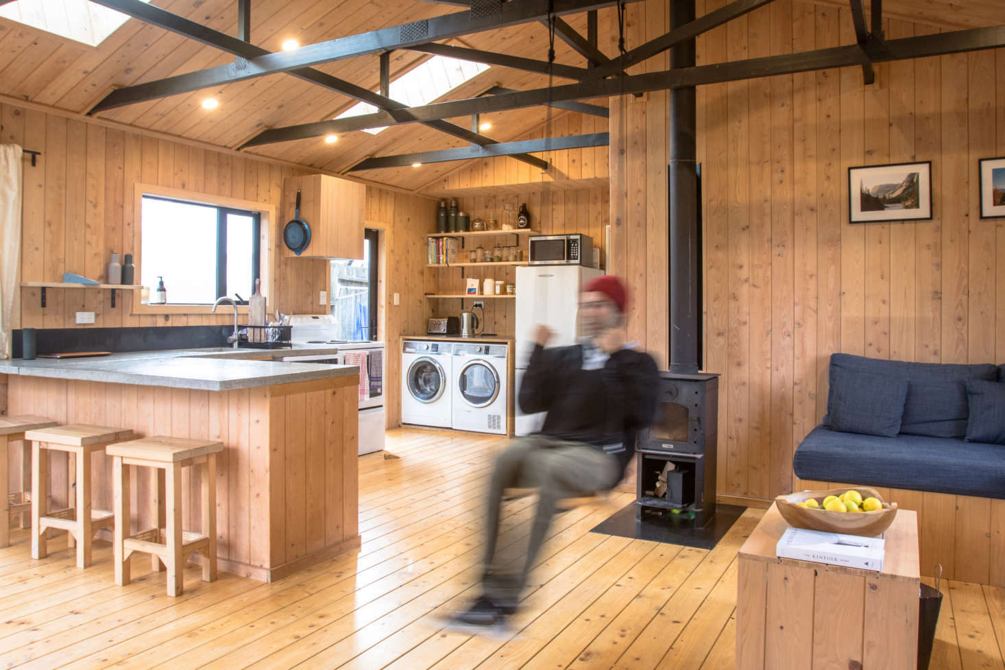 “Probably the biggest change we made to the inside of the house was removing the plaster ceiling, exposing the rafters, and putting in two skylights, says George.
