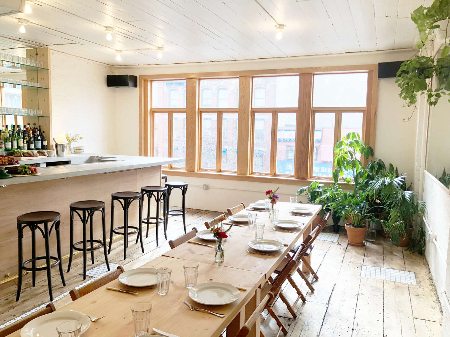 The third floor has no attached kitchen but does have a bar. “We connected the spaces with a dumbwaiter so we can send food upstairs from the kitchen,” he says.