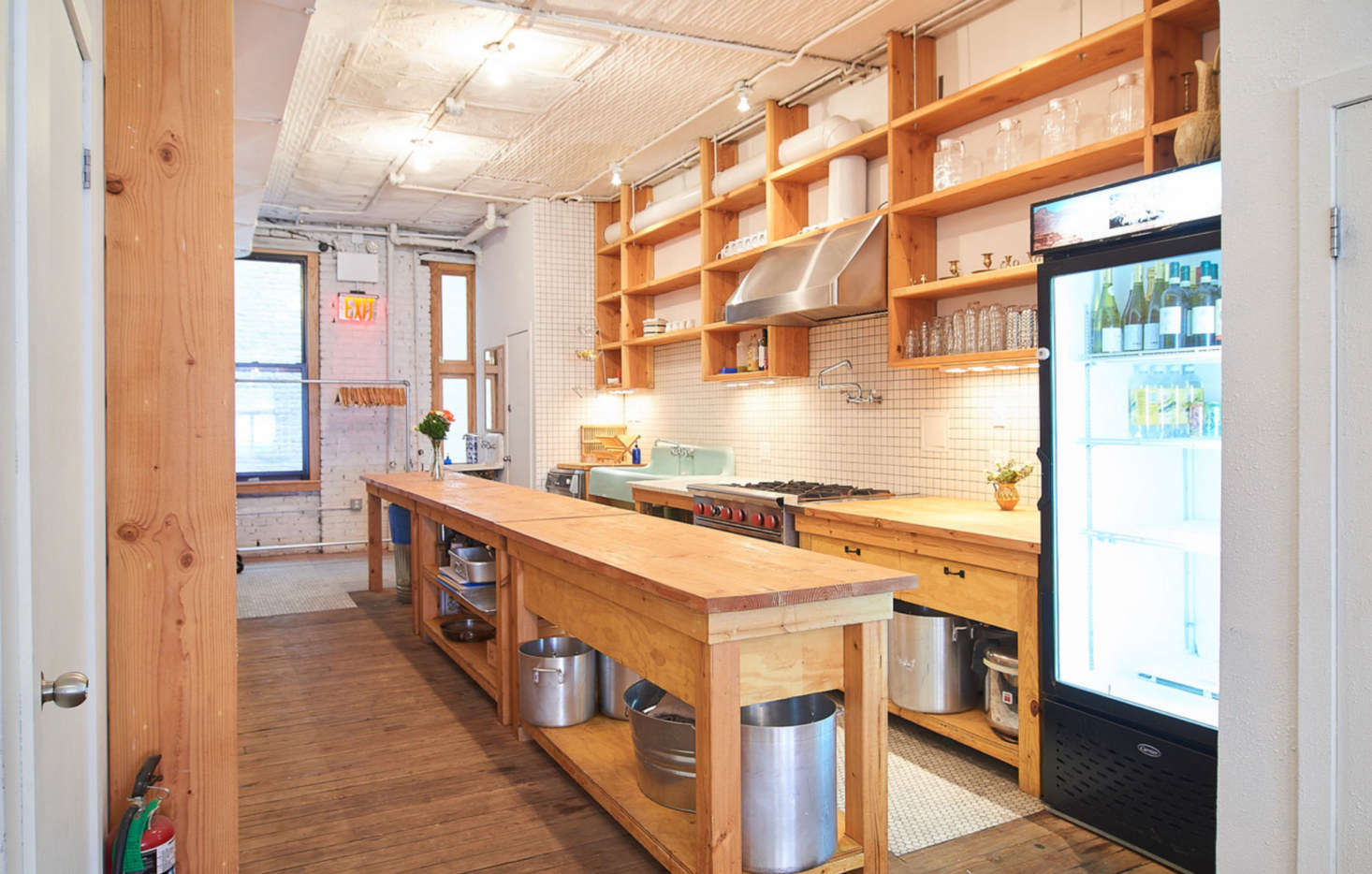 “The glass-door fridge was bought at a used restaurant equipment dealer on the Bowery, run by a wonderfully gangster lady named Penny. I believe it is True brand, my favorite in commercial refrigeration,” says Poe. The pot filler is from a local Chinatown plumbing store called AJ. The industrial stove is from WebStaurantStore.com.