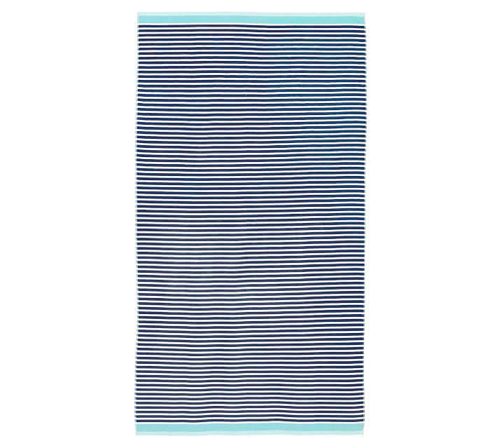 The cotton Mini Stripe Beach Towel (shown above in navy and seabreeze) is on sale for $27 (down from $39.50) at Pottery Barn. It’s also available in red/navy and aqua/yellow.