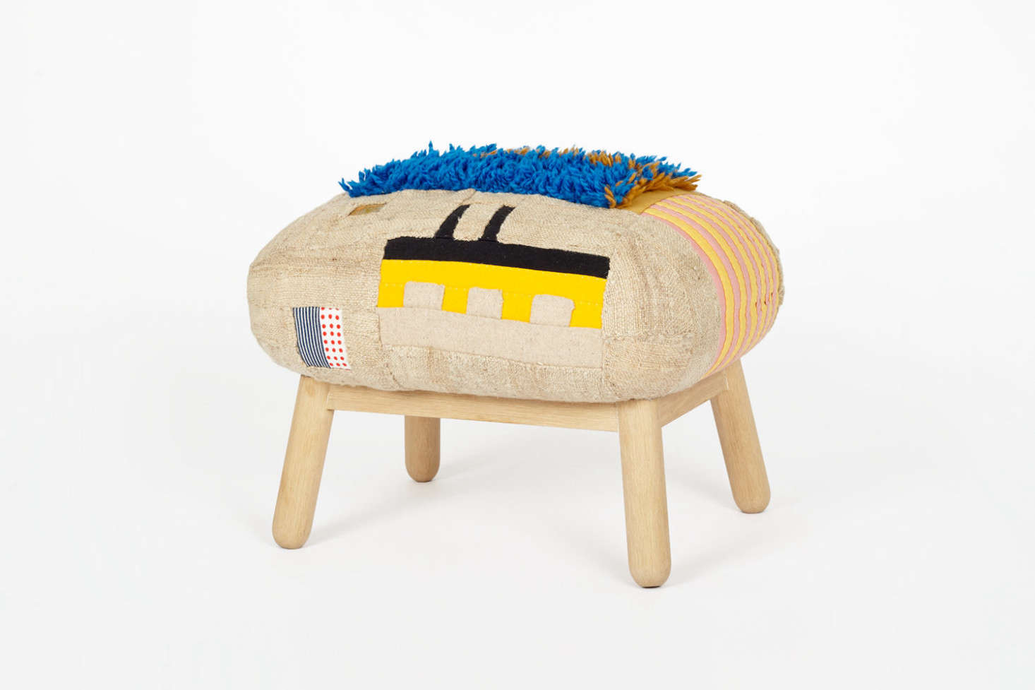Pogue has also created ottomans, stuffed with down feathers atop oak legs, for Commune.