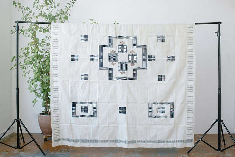 The designs are collaborations. Winfield and Henry bring Dyula motifs they find via scholarly archives and museum collections to the weavers, who then reimagine and update them. The Waraniéné Marron Bedspread is $500.