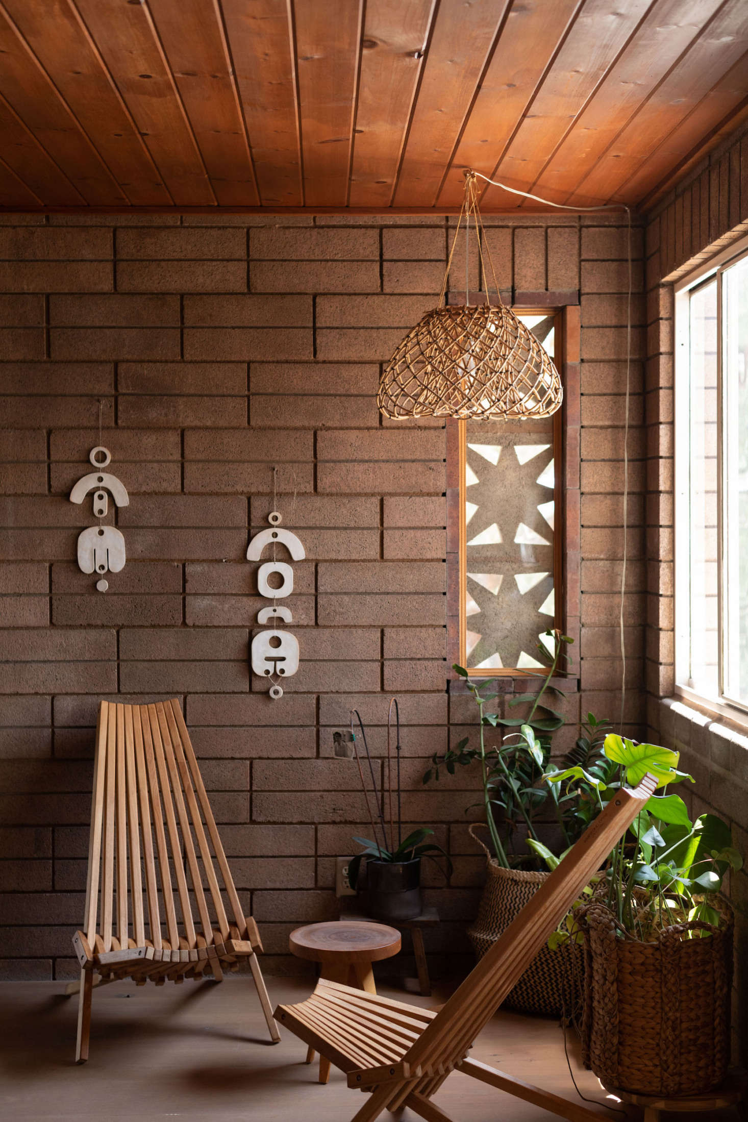 The lamp and wall hangings are all by Wilkinson. For similar foldable chairs, check out GloDea.
