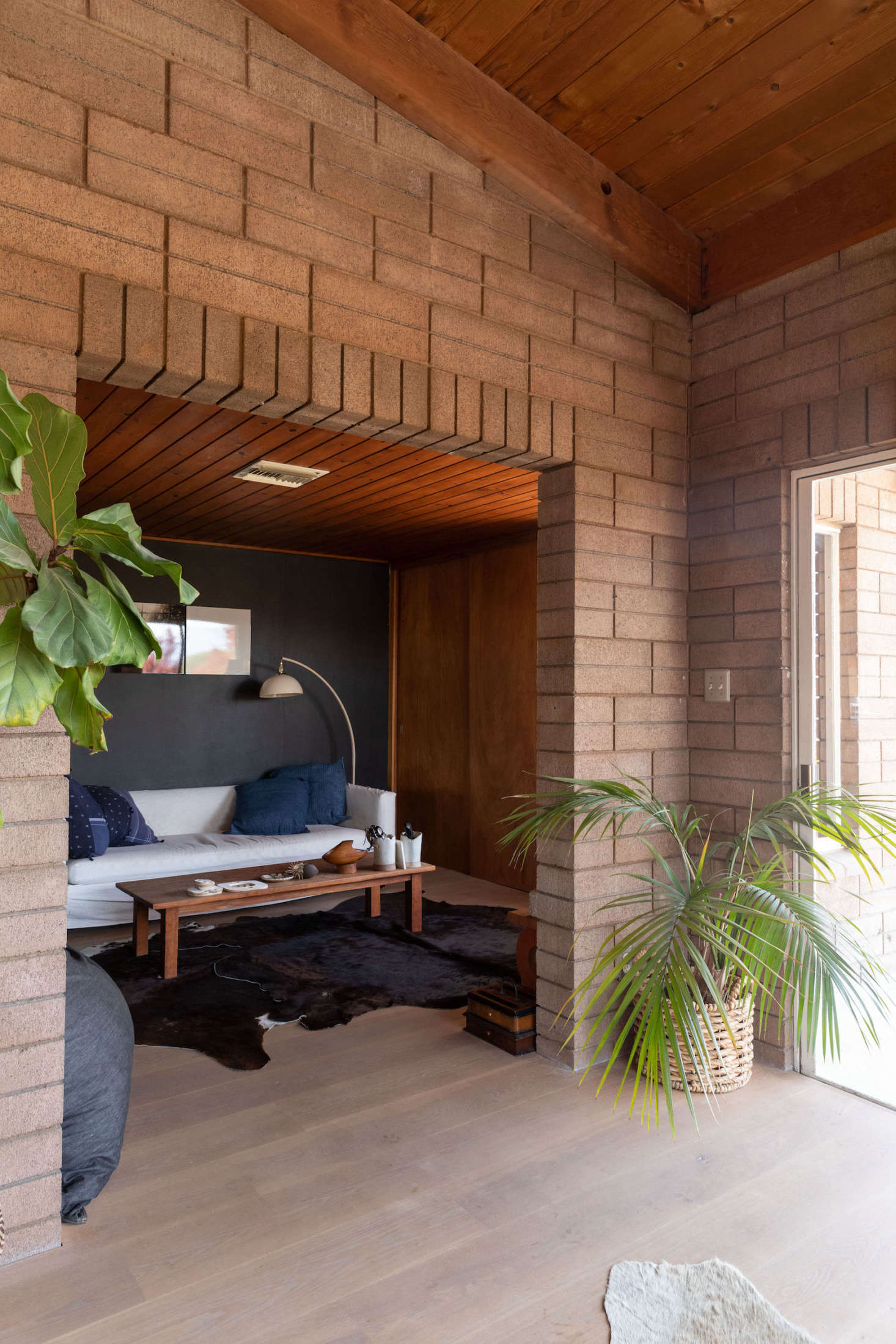 Cowhide rugs add to the “frontier” vibe of the home.