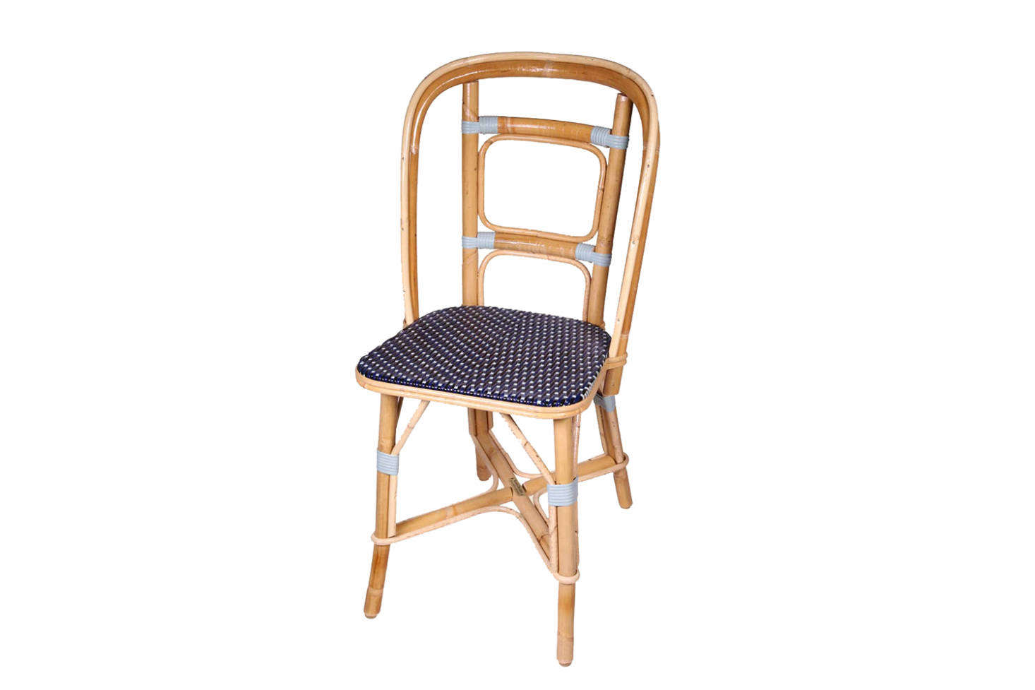 Since its founding in 1885, Maison Drucker of France has specialized in traditional rattan designs made by hand to order in customizable colors. Shown here, the Drucker Chaise Arlequin; inquire for pricing.