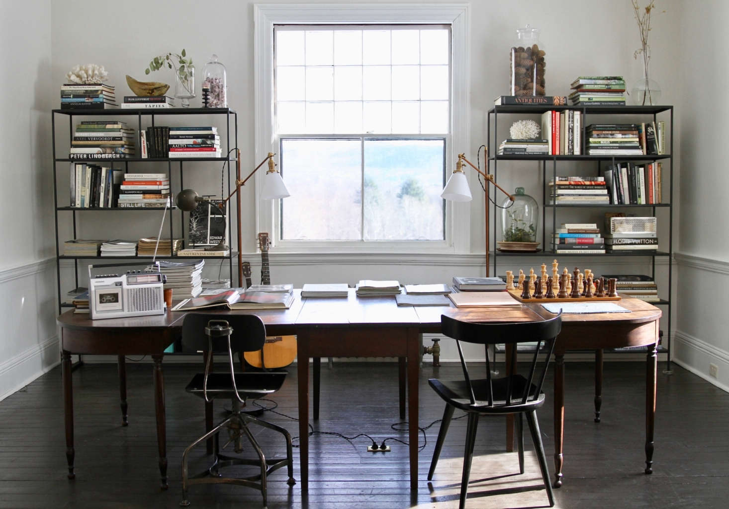 The back parlor has an attached library. While most of the furniture is vintage or antique, the bookcases are from Room & Board.