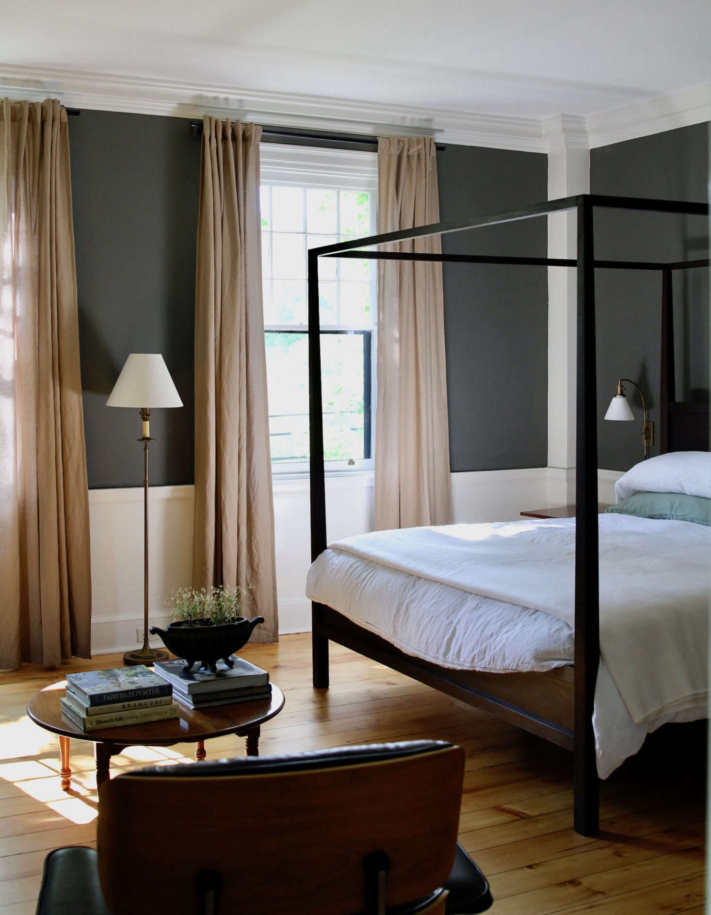 Guest room #3 features a four-poster bed. The walls are painted Kendall Charcoal, the trim Glacier White.