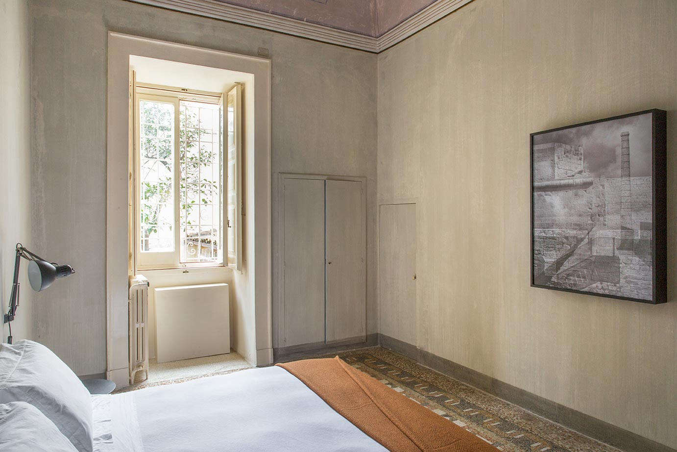 A bedroom in a Junior Suite. Note the nearly invisible doors set into the textured walls.