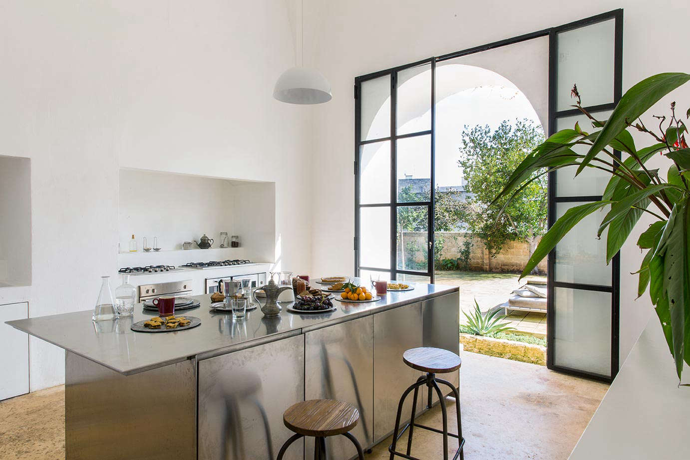 The villa’s chef serves breakfast, lunch, and dinner, all made from ingredients from local farms, in a clean-lined kitchen overlooking the swimming pool. Guests are free to gather here.