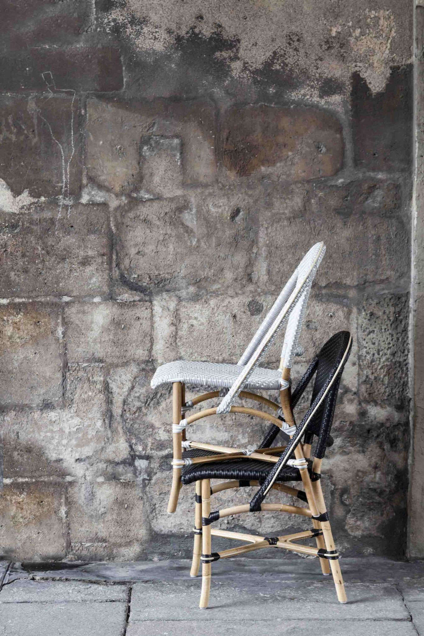 After hours in Paris cafés, bistro chairs get piled in tall stacks. Shown here, the Sofie Side Chair in two of its seven color combinations; $340 each from Sika Design.