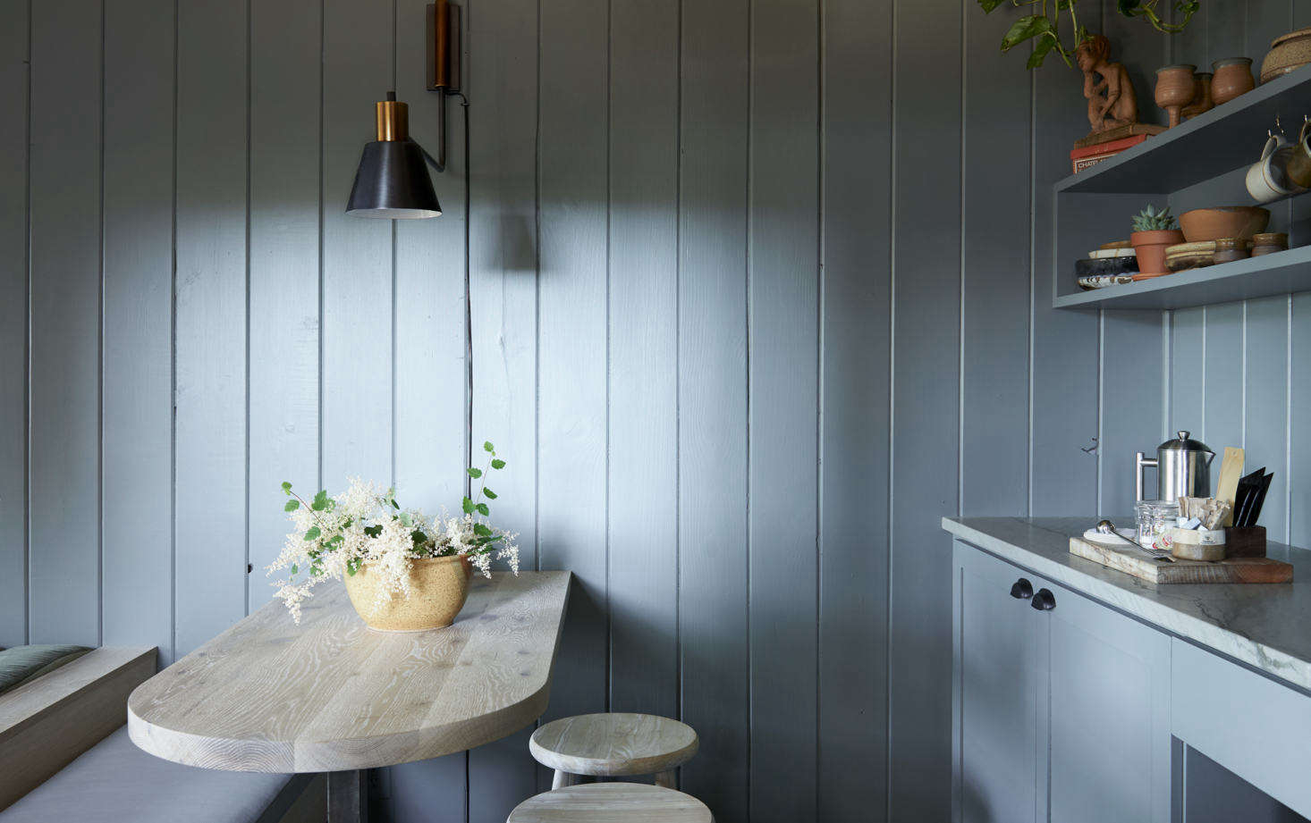 The kitchenette and breakfast nook in the cabin designed by Vancouver studio We.The.Nomads.