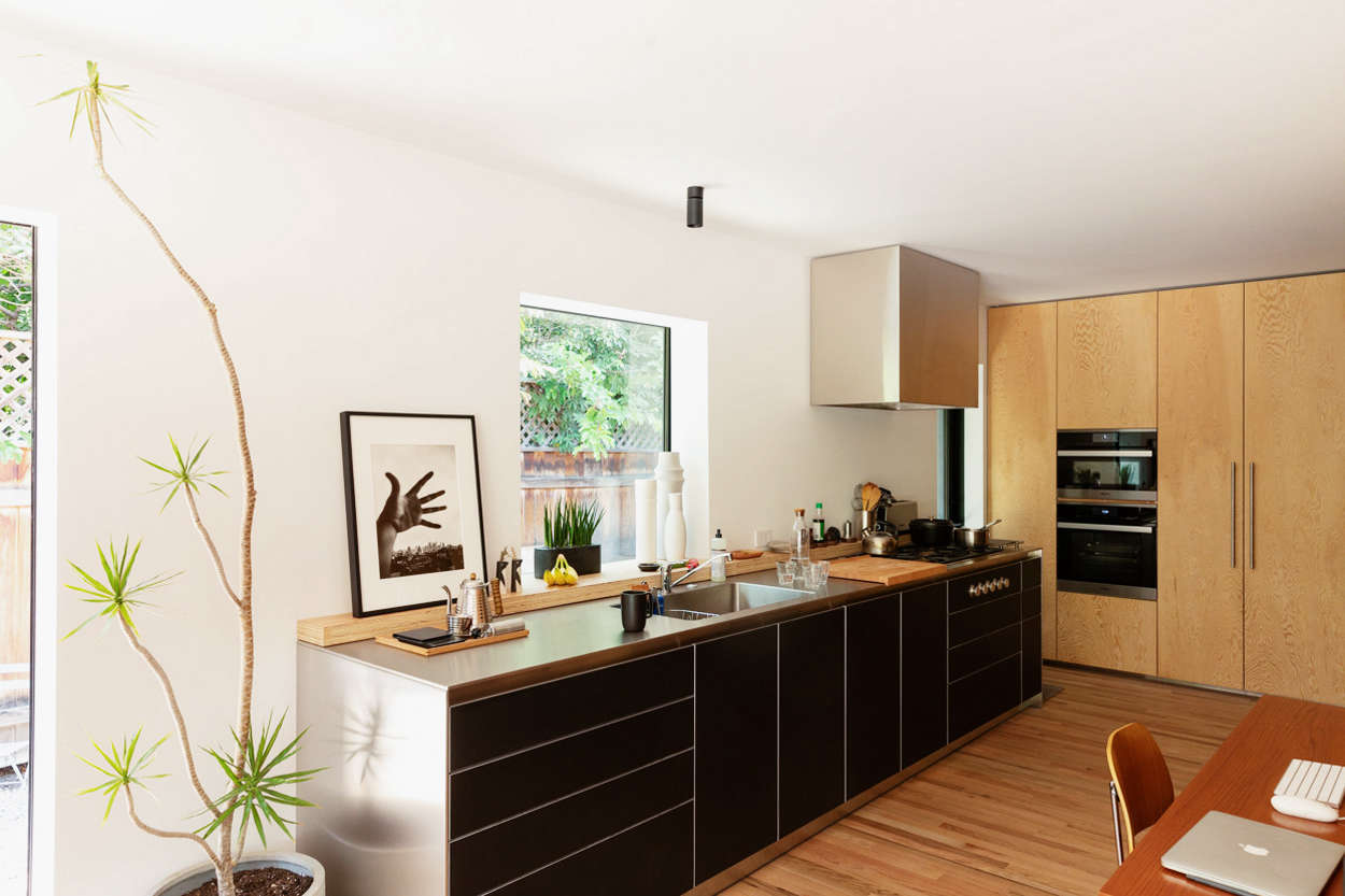 Yanai chose compact appliances: there’s an 18-inch dishwasher by Miele to the right of the sink (and next to it is the trash). The five-burner cooktop is from Gaggenau’s Vario 400 Series and the hood is “a simple vent with custom stainless housing designed to be as simple in shape a possible.”