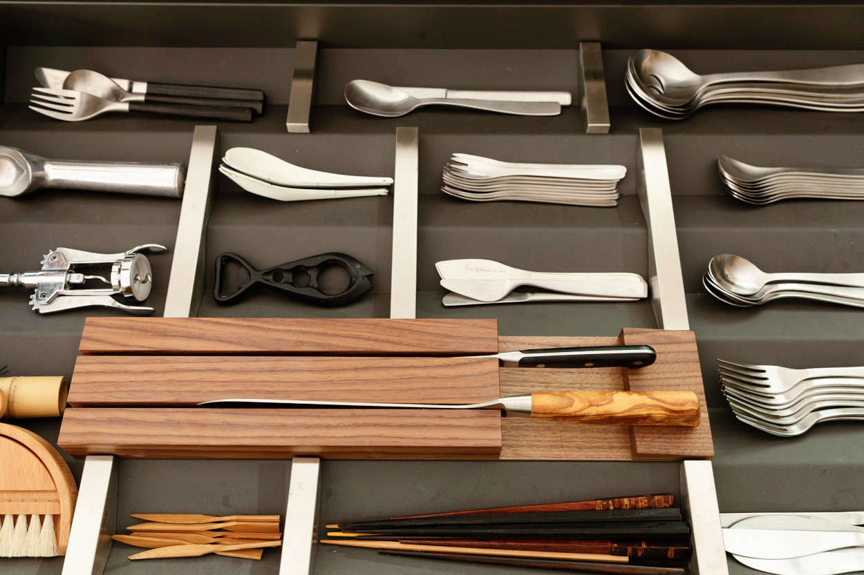 Bulthaup’s B3 drawer inserts of aluminum, steel, and wood can be arranged and rearranged. The family’s everyday flatware is Muji’s 18-8 Stainless Steel Cutlery designed by Jasper Morrison (which starts at $2 for a small fork); in the back, Yanai keeps “examples of other cutlery I like by Jasper Morrison for Alessi and also Sori Yanagi.”