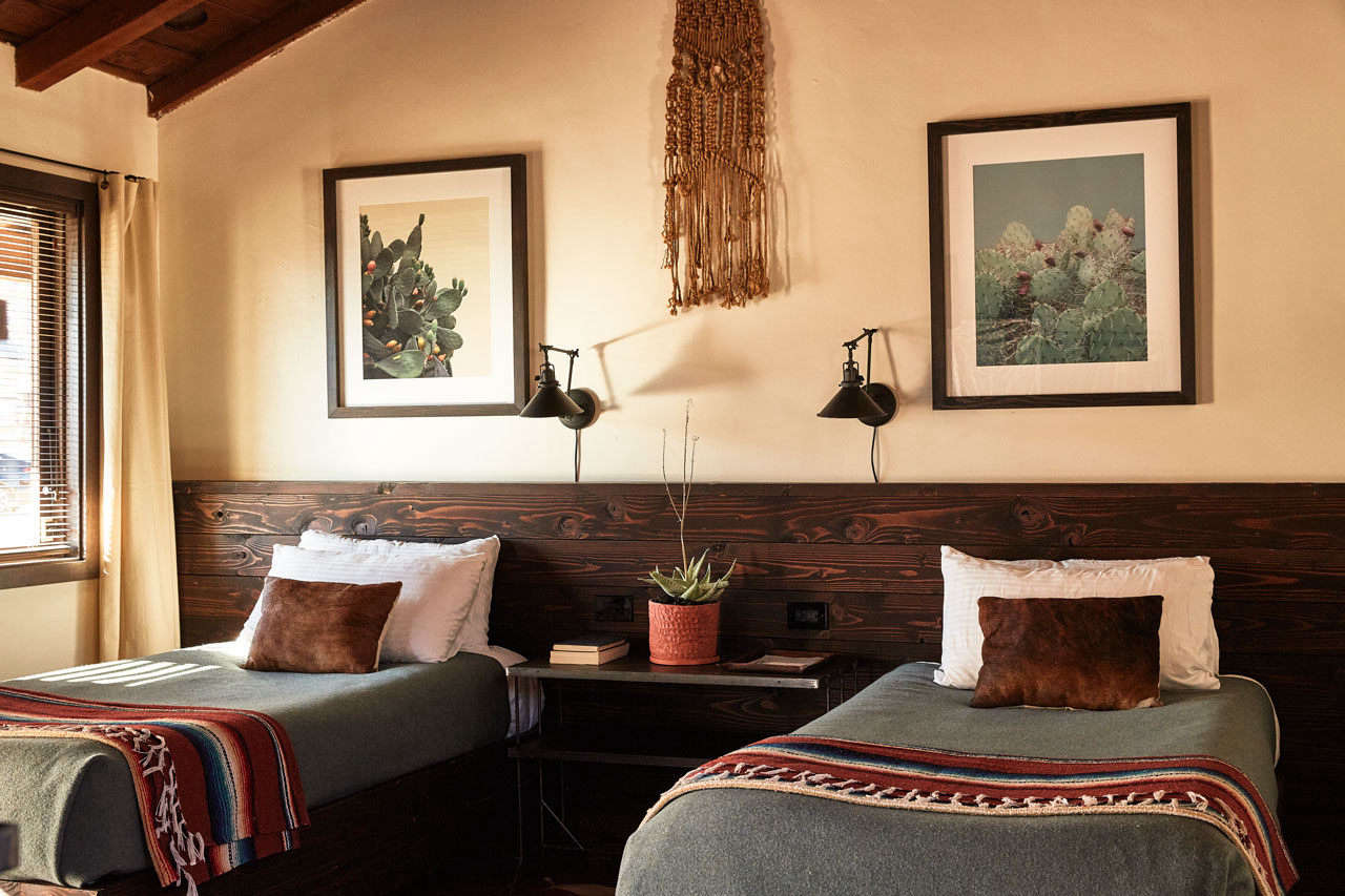 Pendleton and serape blankets cover each bed.