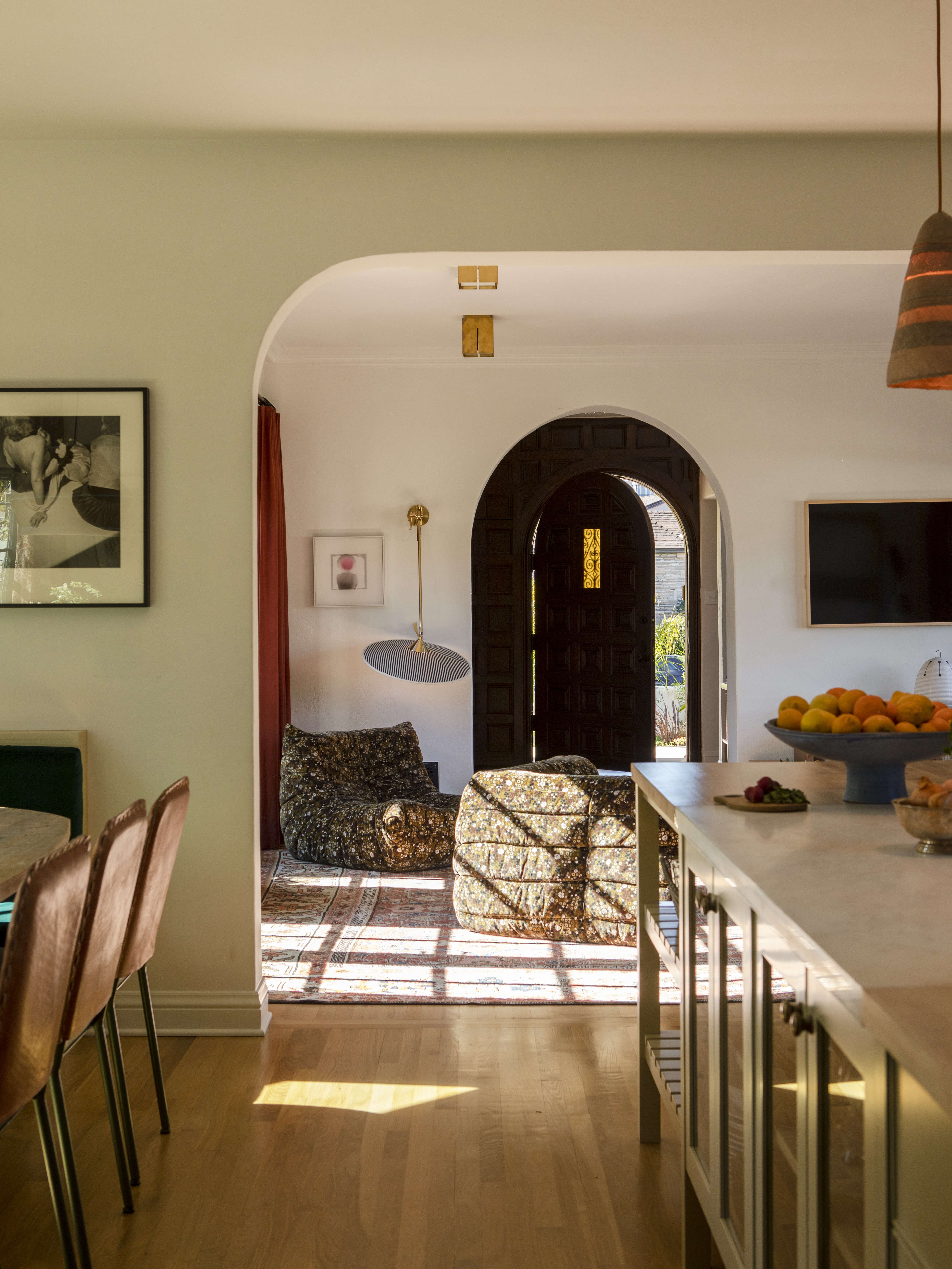 Not wanting a formal dining area, the family turned the room off the kitchen into a den.
