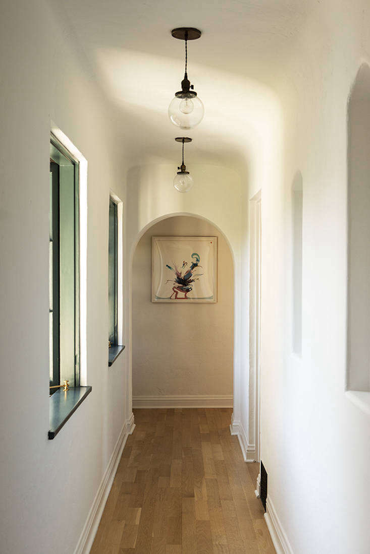 Painted window frames and vintage globe lights from Factory .