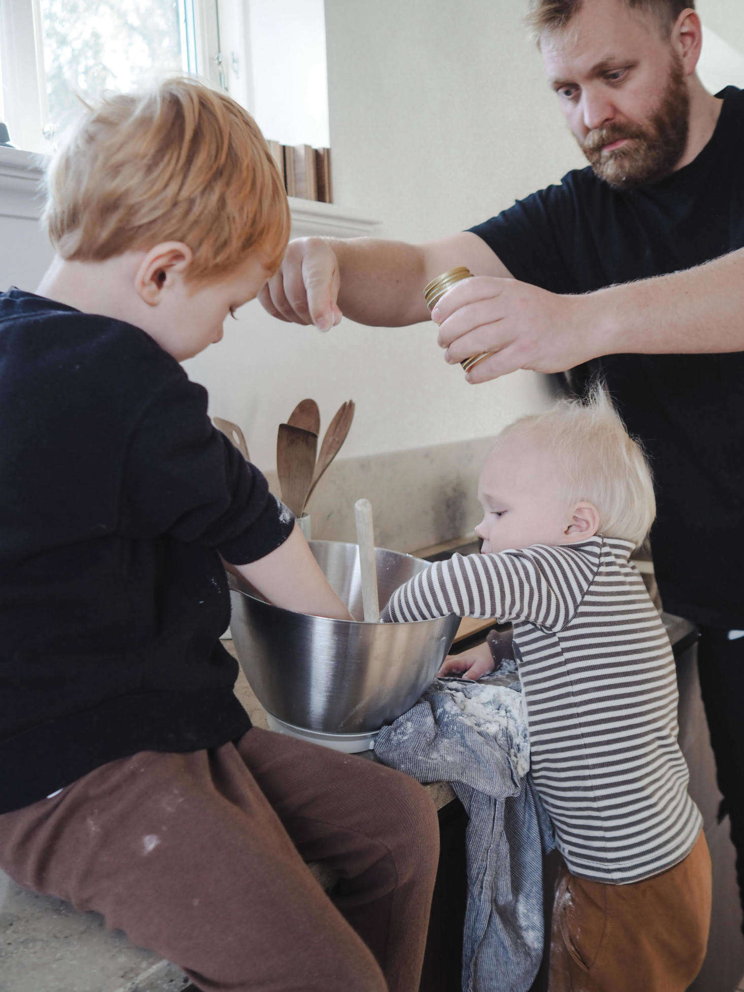 Kristoffer assists in waffle batter production.