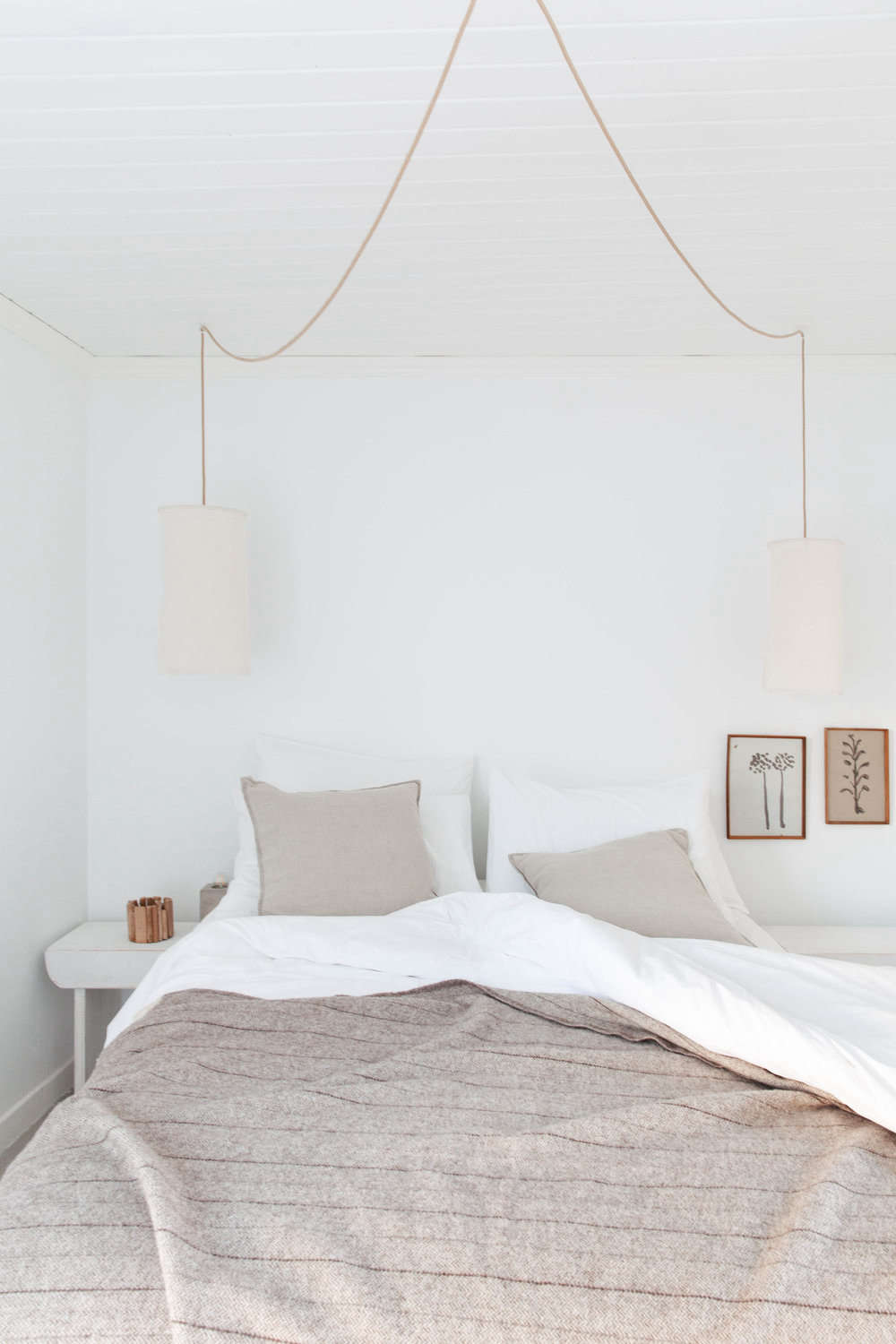 Guest rooms are kept neutral, too, with pressed-flower prints and thick blankets.