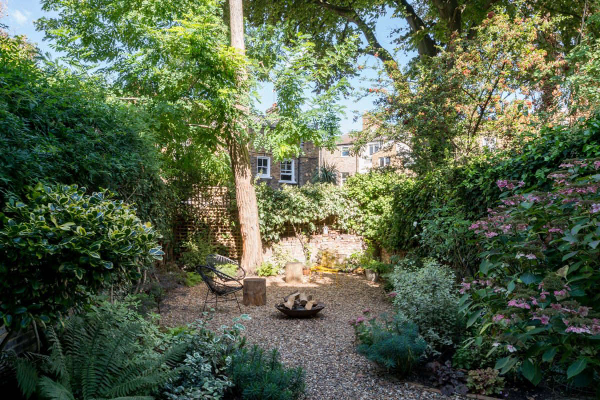 The stone patio gives way to gravel. 