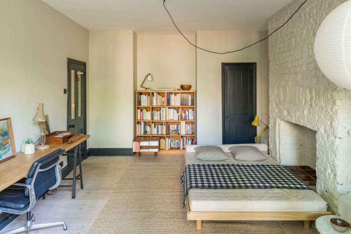 The garden room also acts as a guest room. Paul designed the platform bed, and his dad made it: 
