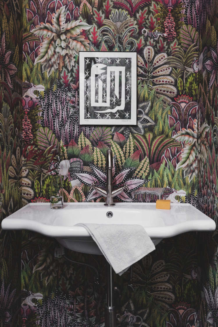 The aforementioned crash course in wallpapering was for the powder room, now cloaked in Cole & Son