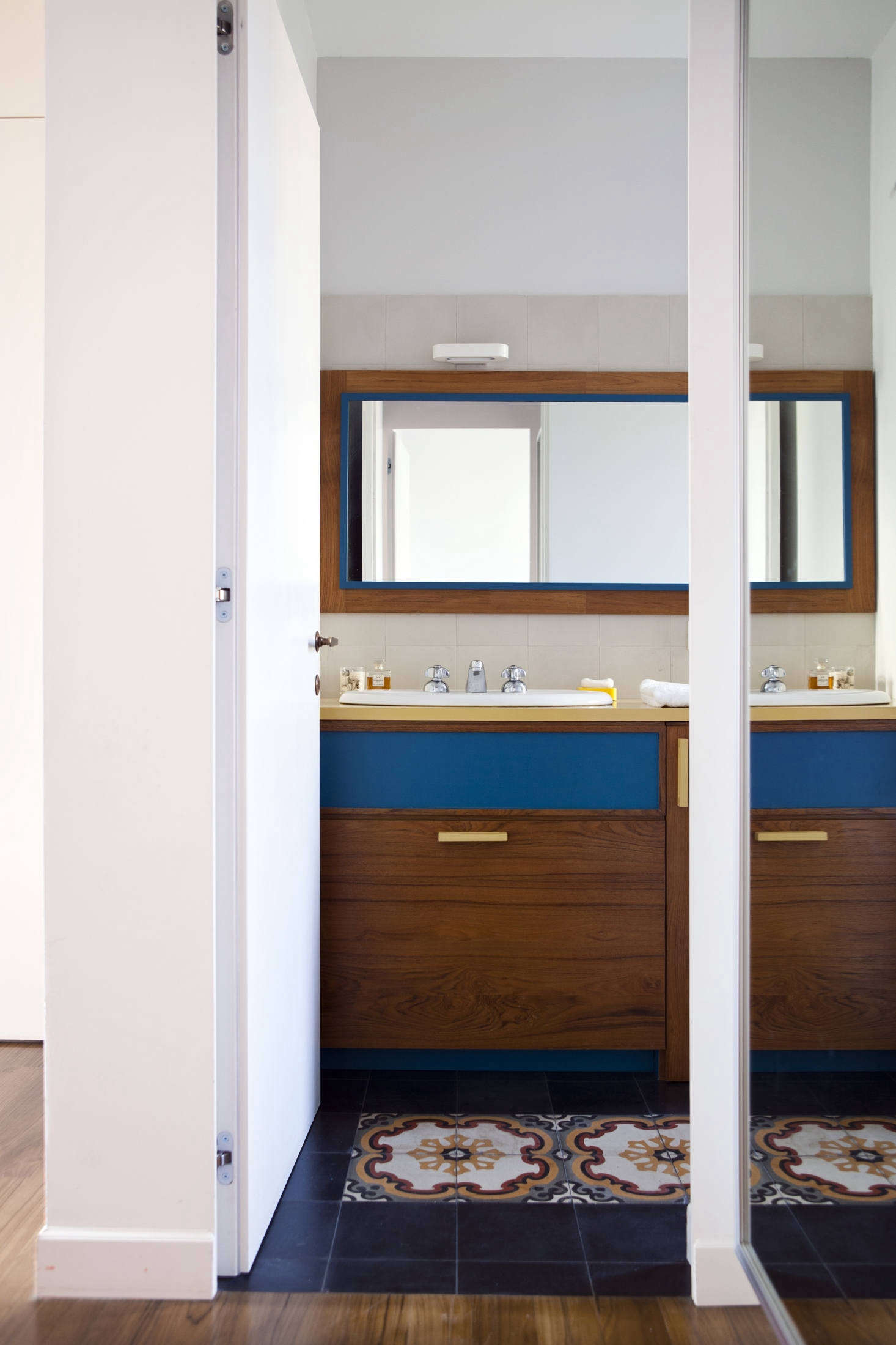 One of two bathrooms. Hand-glazed tiles appear throughout the house like stepping stones: 