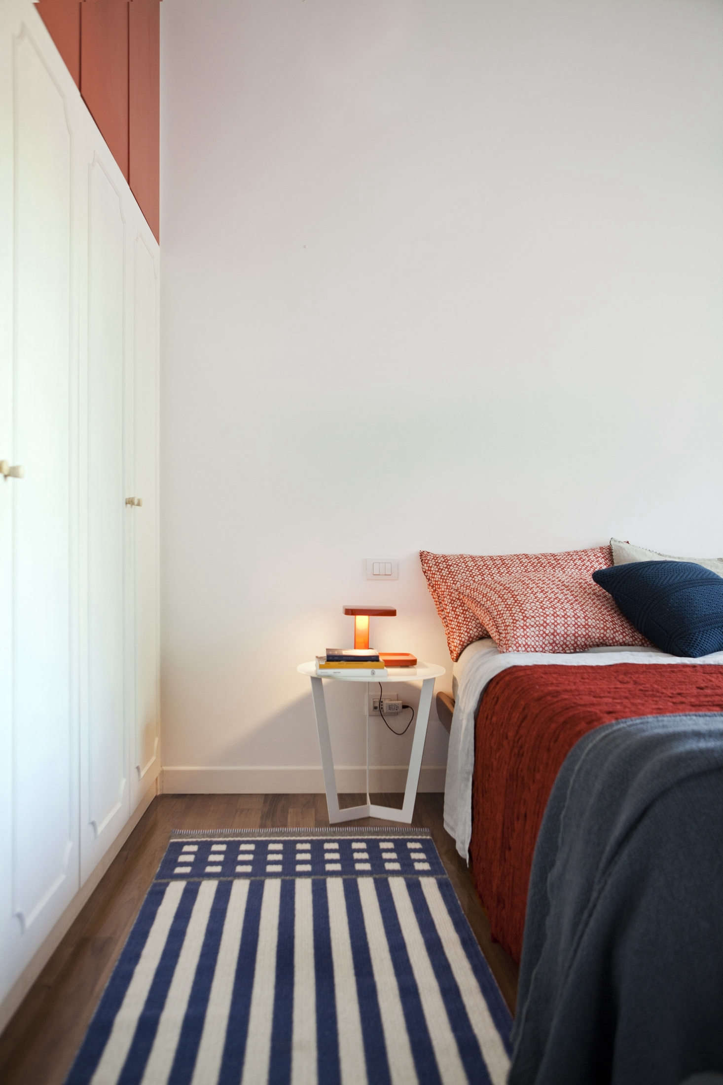 The bed is outfitted in linens and blankets from Society Limonta.