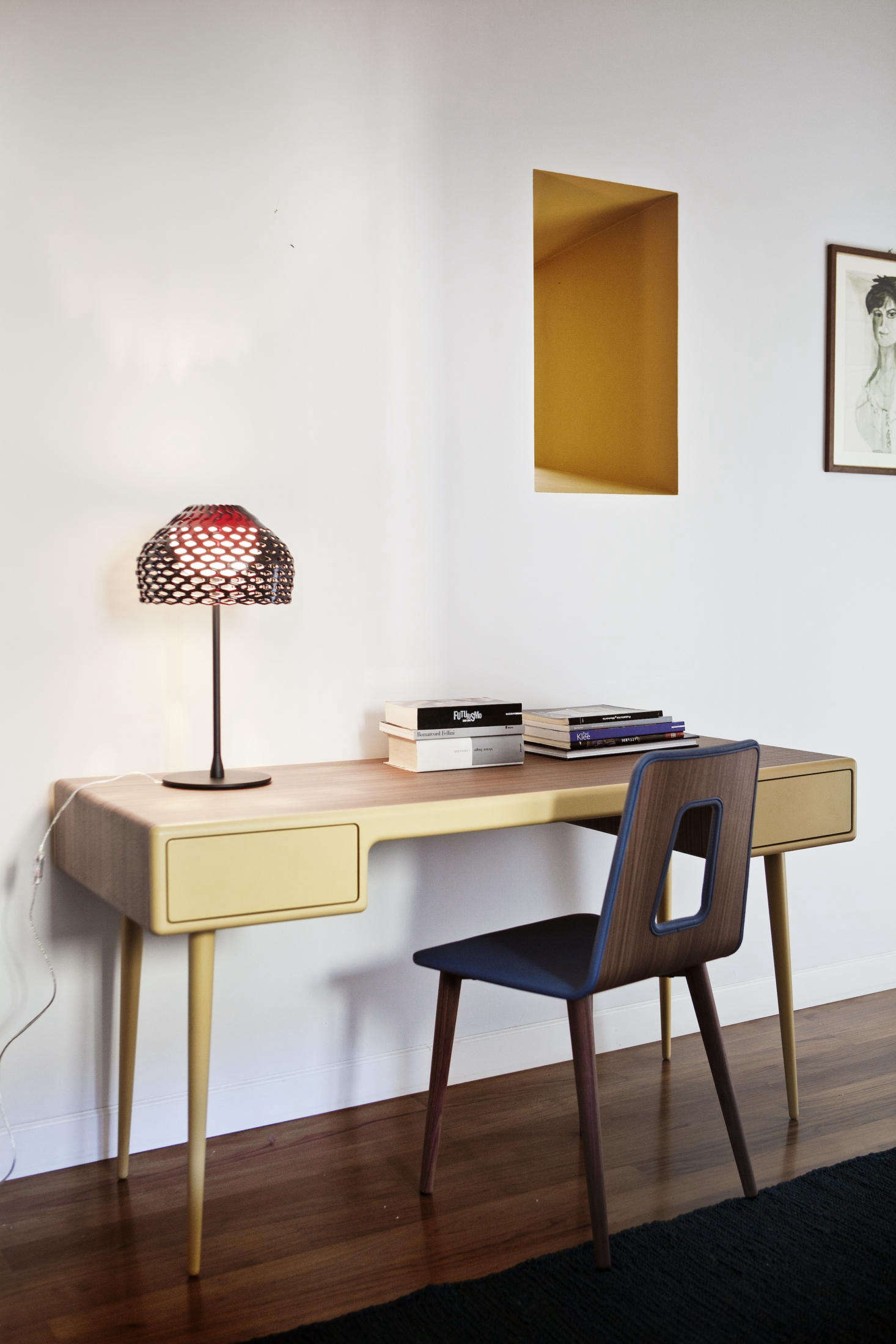 One yellow-painted passageway looks through to a small desk area.