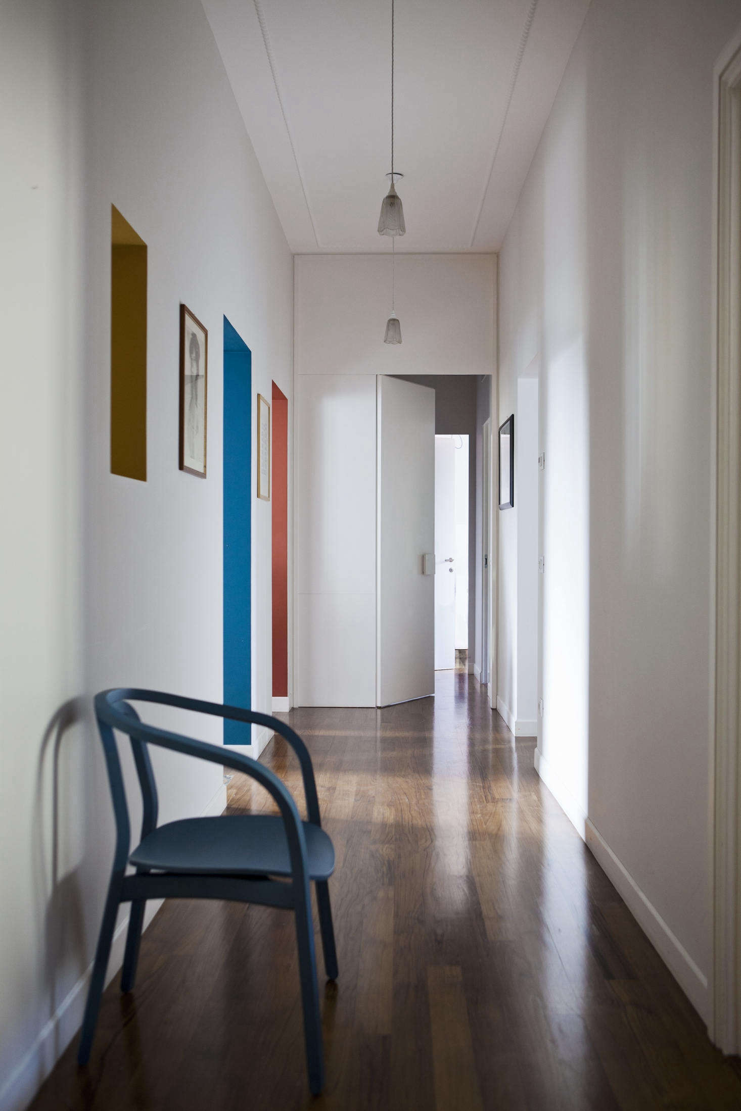 The architects used paint in an unusual way throughout, like painting the insides of doorways in Tuscan Red and Gauze Dark, both by Little Greene. Looking down the hall, the doorways almost look like canvases hung on the walls.