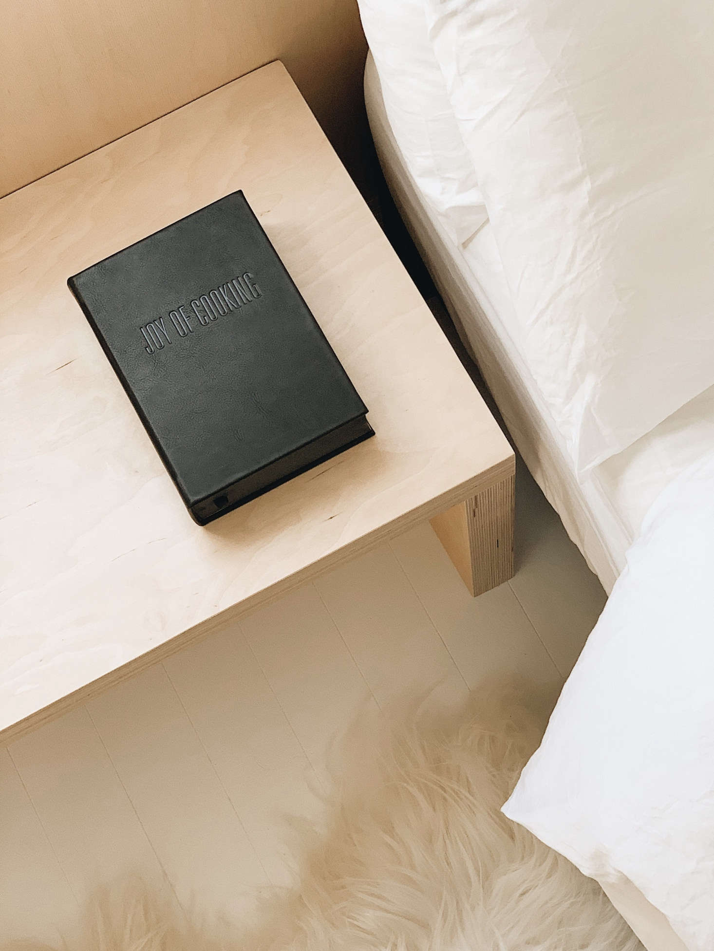 Bedside reading: the 75th anniversary edition of the Joy of Cooking bound in leather. The house is also stocked with a set of Modernist Cuisine Books.