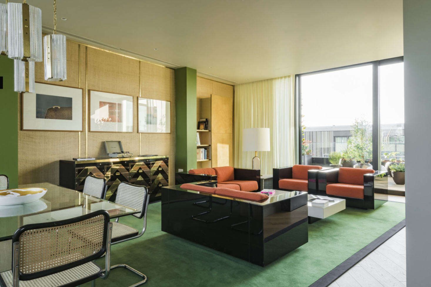 The collection of vintage furnishings was sourced by Maria Speake, co-founder of Retrouvius. The deep green carpet with black border is a favorite of Freud