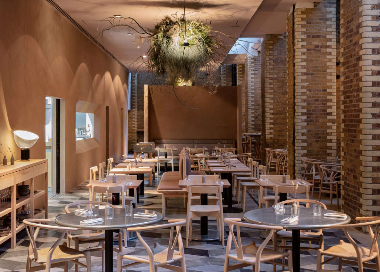 One of the most striking features in the space is the terracotta-colored wall, a new addition. It