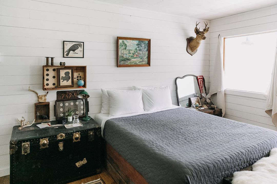 The trunks serve as bedside tables (and extra bedding storage) at the Red Rose.