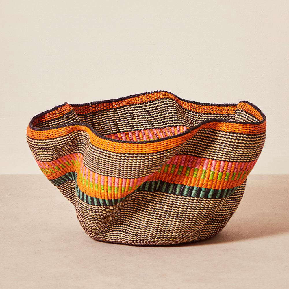 Another favorite from the collection: one-of-a-kind handwoven Pakurigo Baskets, made of vetiver grass by Baba Tree