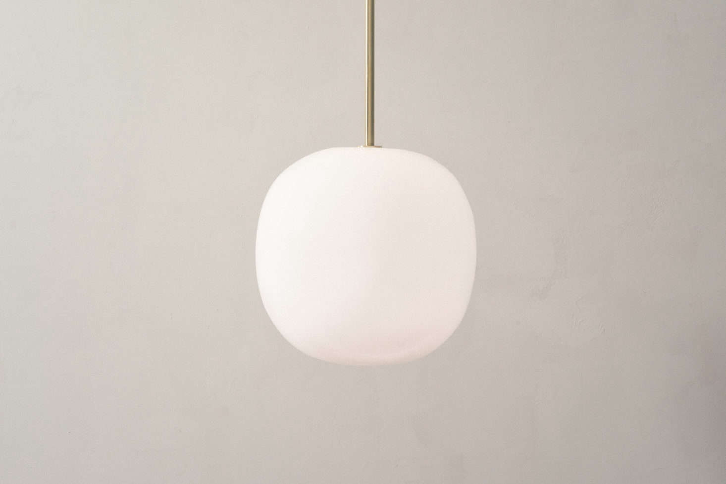 The glass and brass Boulder Pendant mimics the organic form of its namesake; $975.