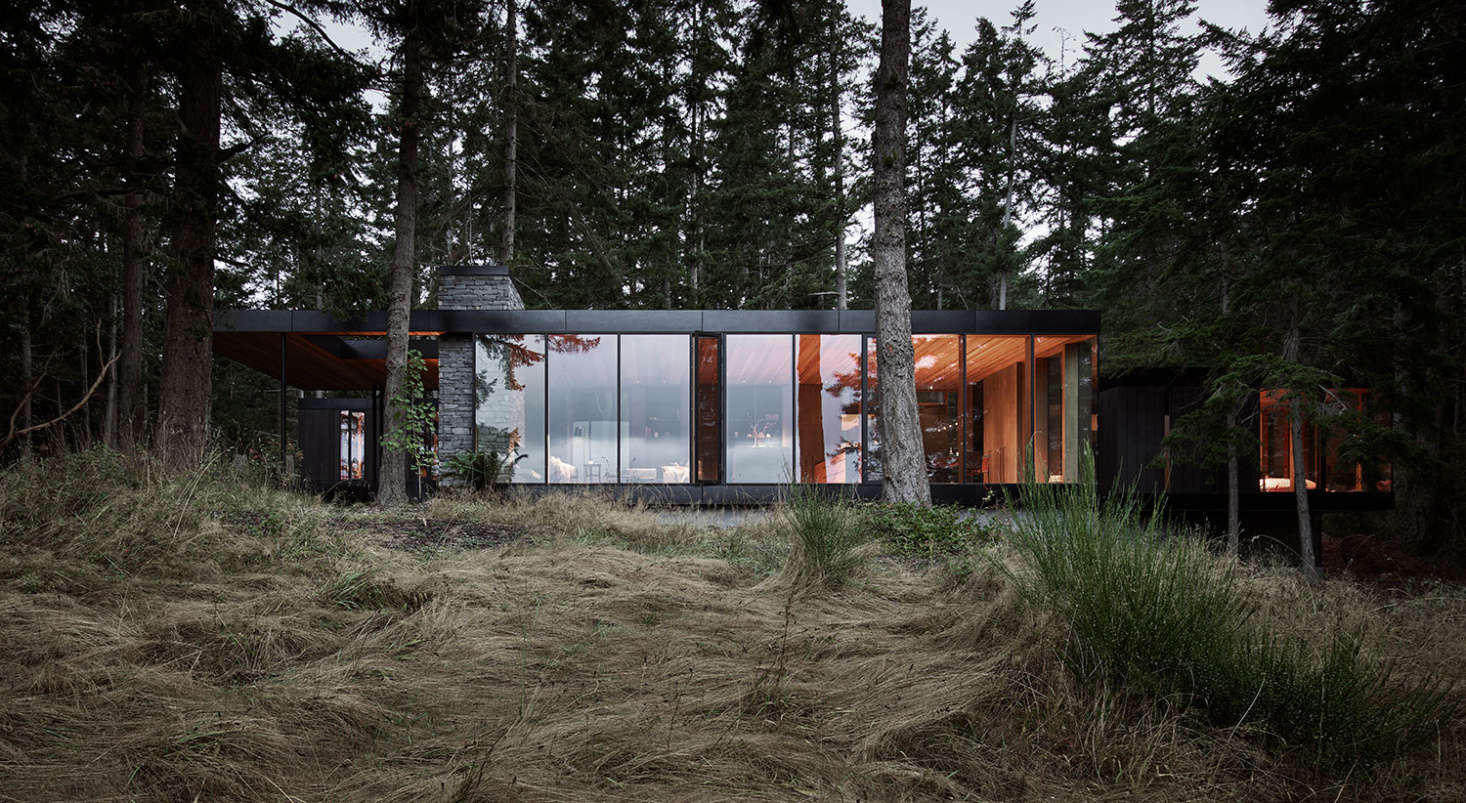 The structure was designed to recede into the forest. At the owners