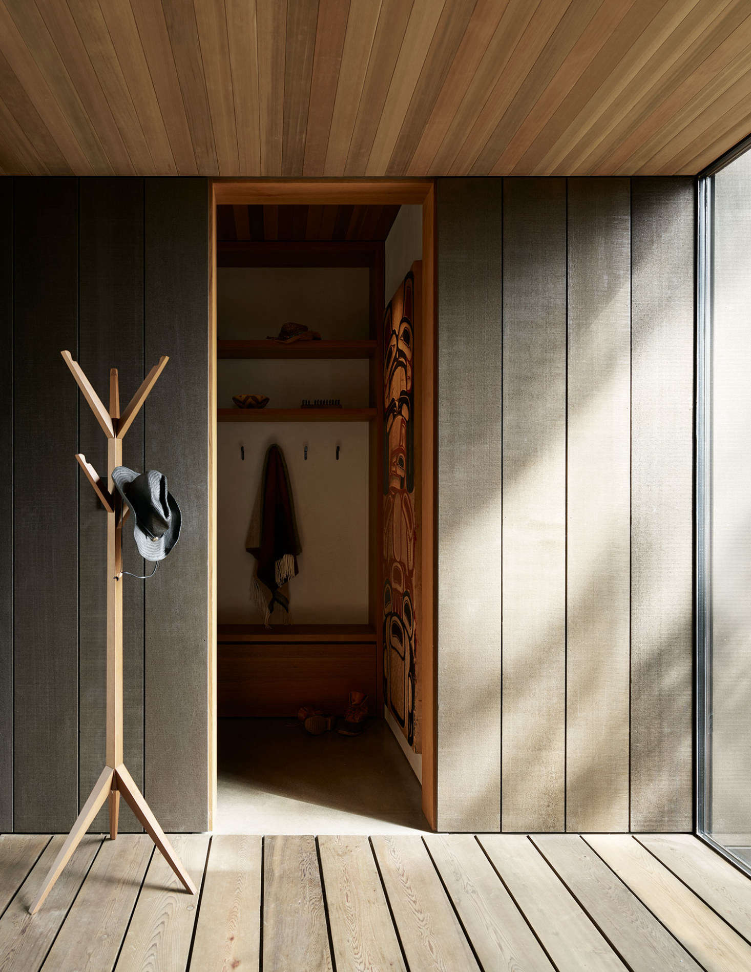 The entry. Note the carved wood panel on display in the mudroom area. 