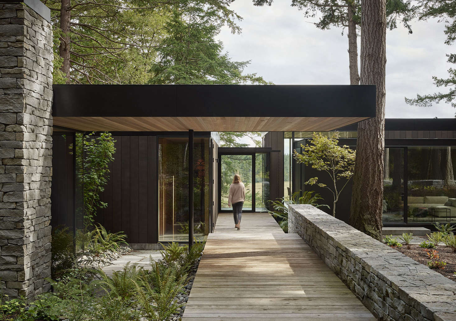 Locally quarried basalt make up the courtyard wall and parts of the home&#8