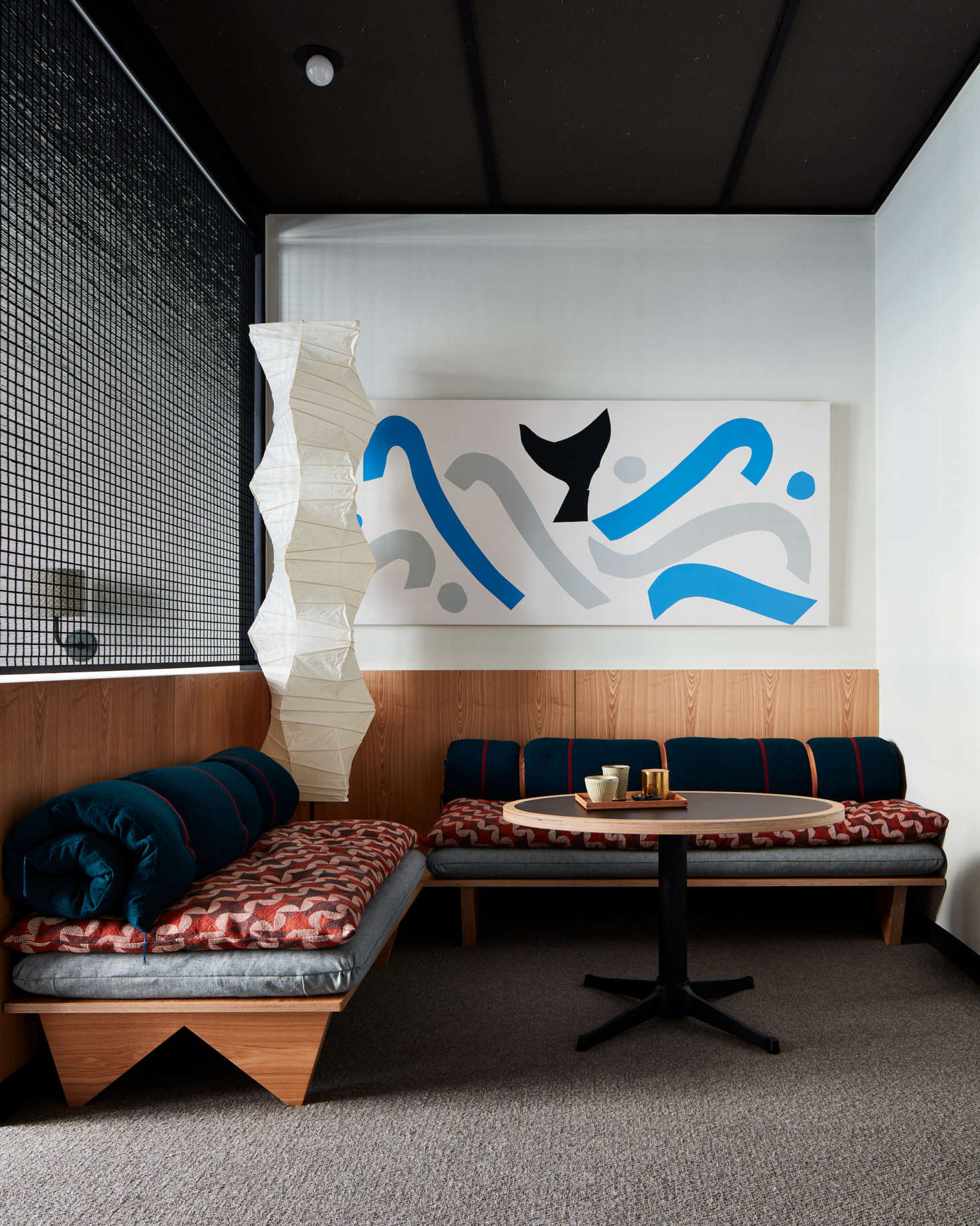 Art by local artists is displayed throughout the hotel. A classic Akari Noguchi floor lamp presides over the sitting area of a guest room. (See src=