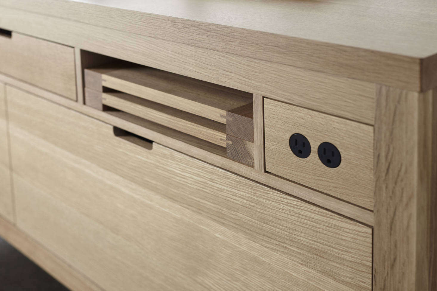 Note the integrated electrical outlets and custom cutting boards.
