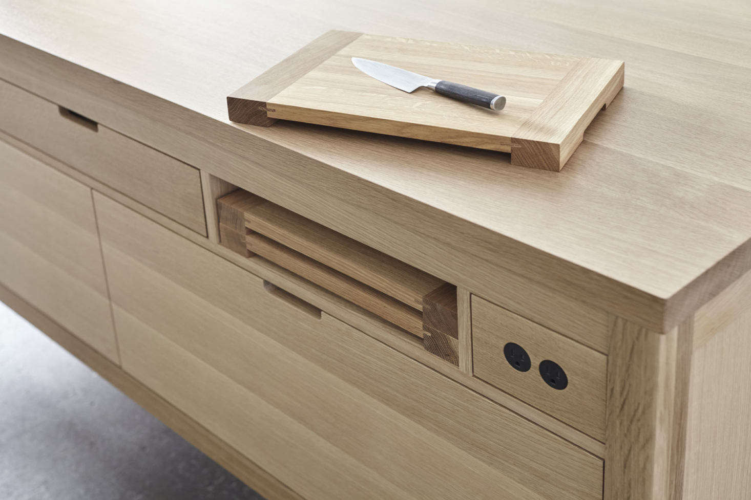 When not in use, the cutting boards are tucked away in an easy-to-reach niche.